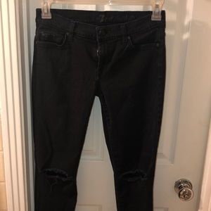 Black jeans with rips in knees